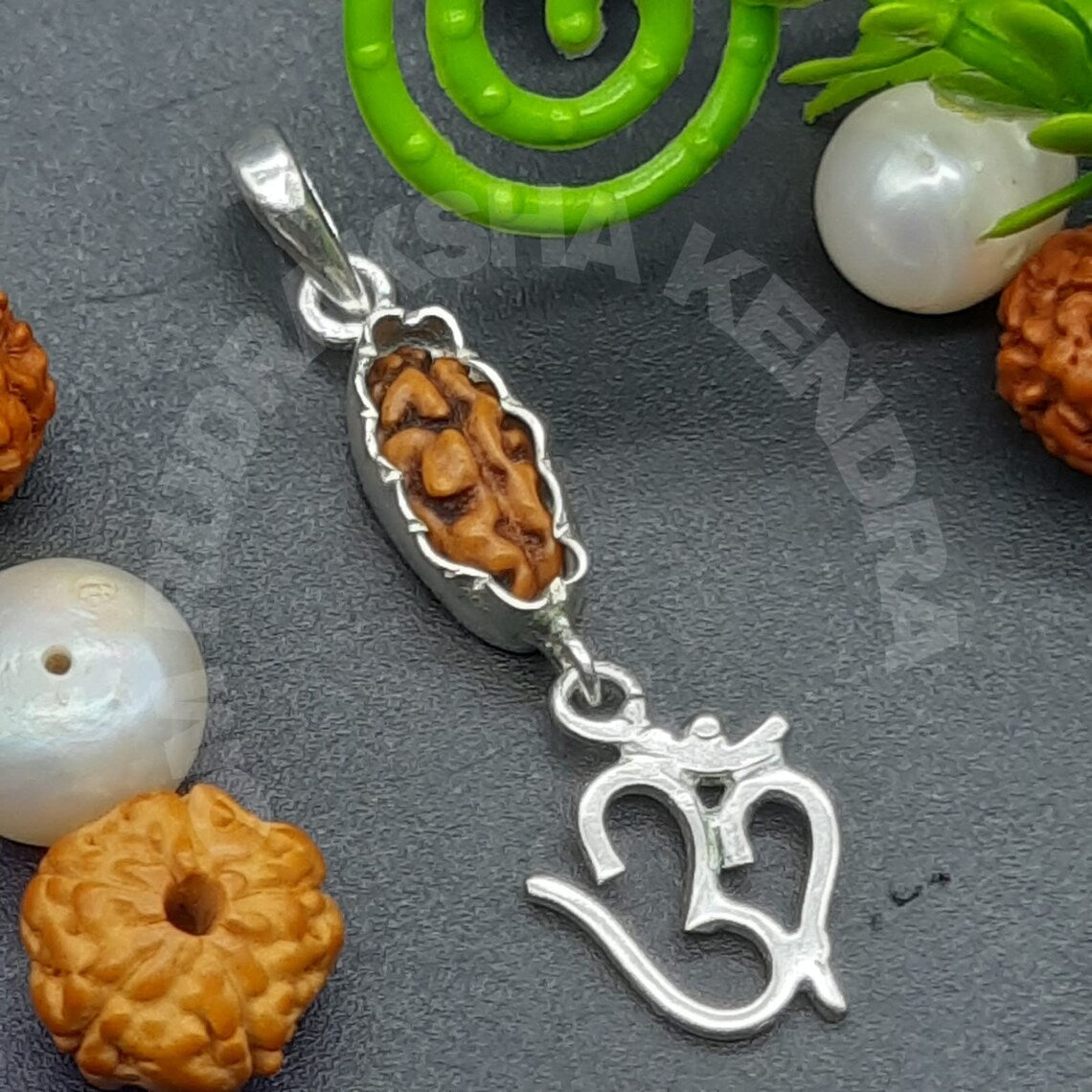 Ek Mukhi / One face java rudraksha with pure silver om pendant 11mm - Lab Certified