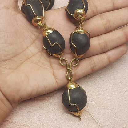 Natural Ladoo Gopal Shaligram Ji Mala in Gold Plated Capping - 32+1 Beads for Meditation & Spiritual Practice
