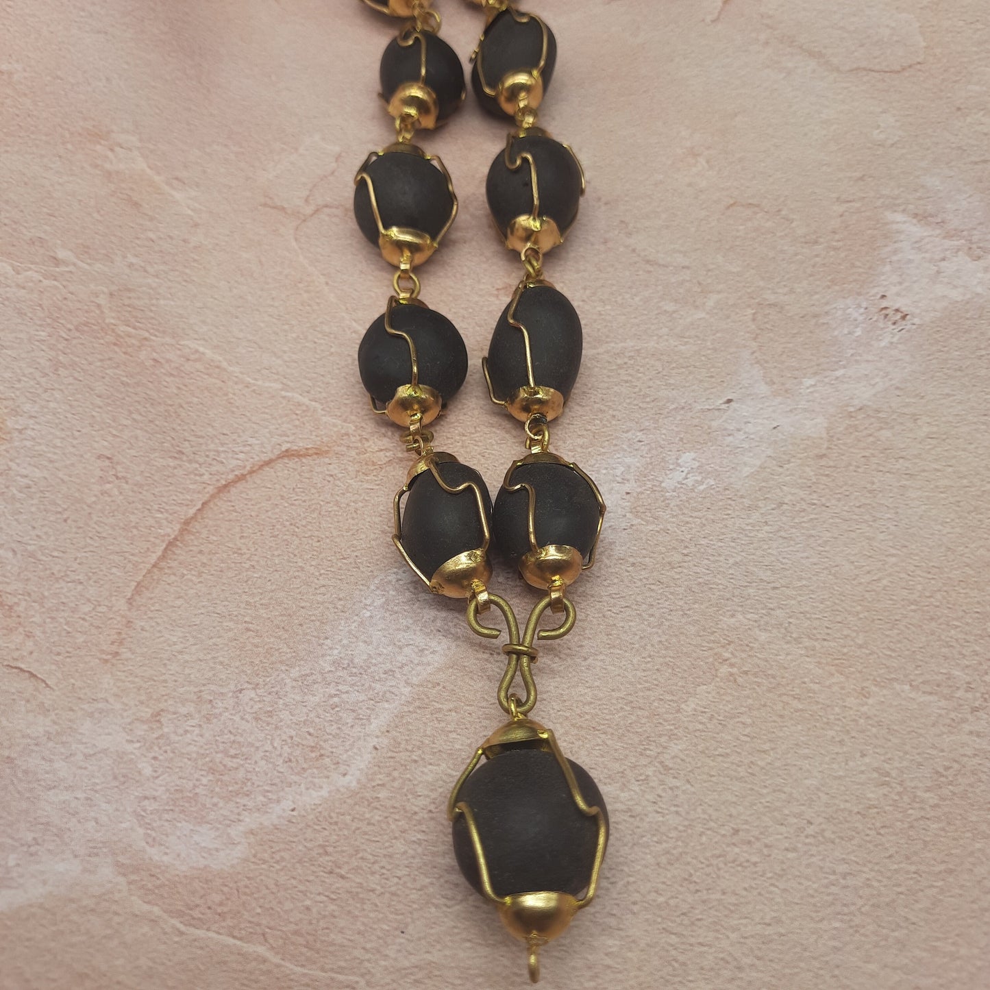 Natural Ladoo Gopal Shaligram Ji Mala in Gold Plated Capping - 32+1 Beads for Meditation & Spiritual Practice