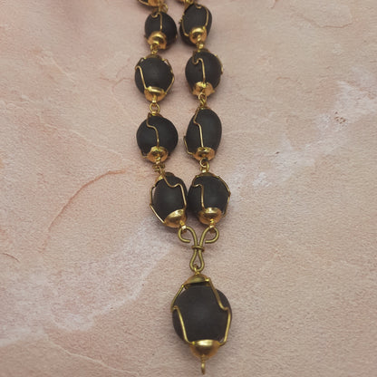 Natural Ladoo Gopal Shaligram Ji Mala in Gold Plated Capping - 32+1 Beads for Meditation & Spiritual Practice